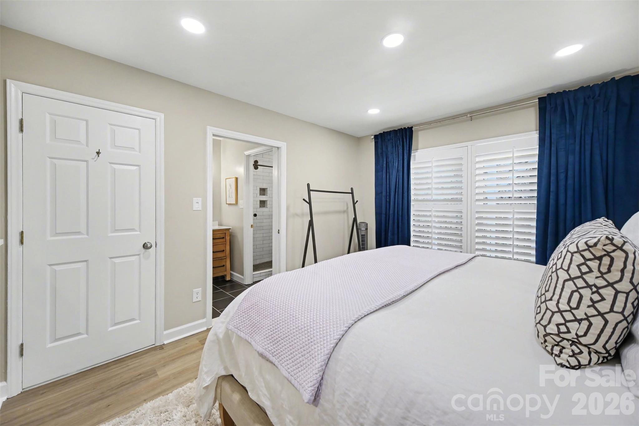 6008 Alexa Road Charlotte, NC 28277 - Photo 38 of 46 a spacious bedroom with a bed and a dresser