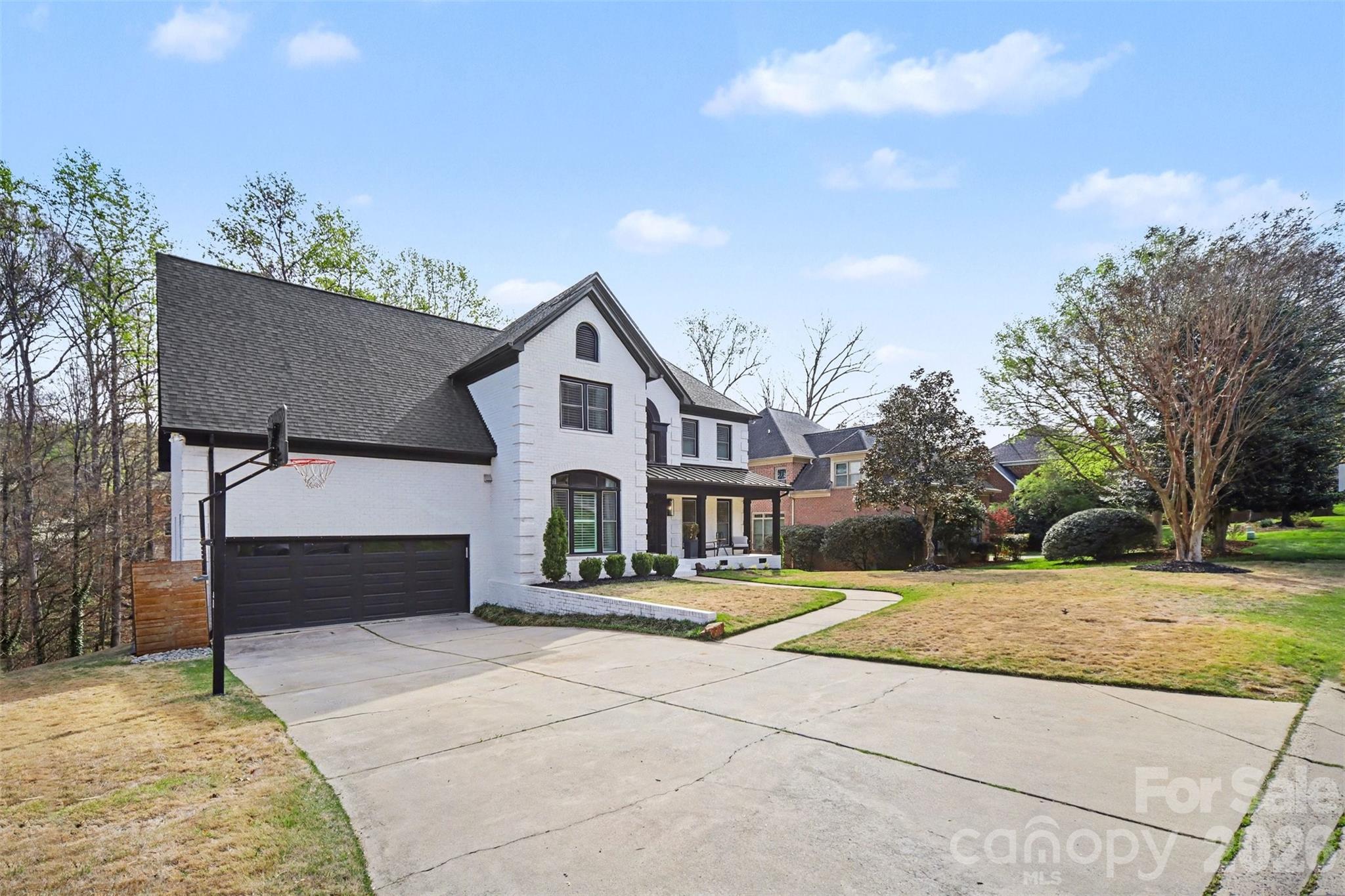 6008 Alexa Road Charlotte, NC 28277 - Photo 45 of 46 a front view of a house with a yard