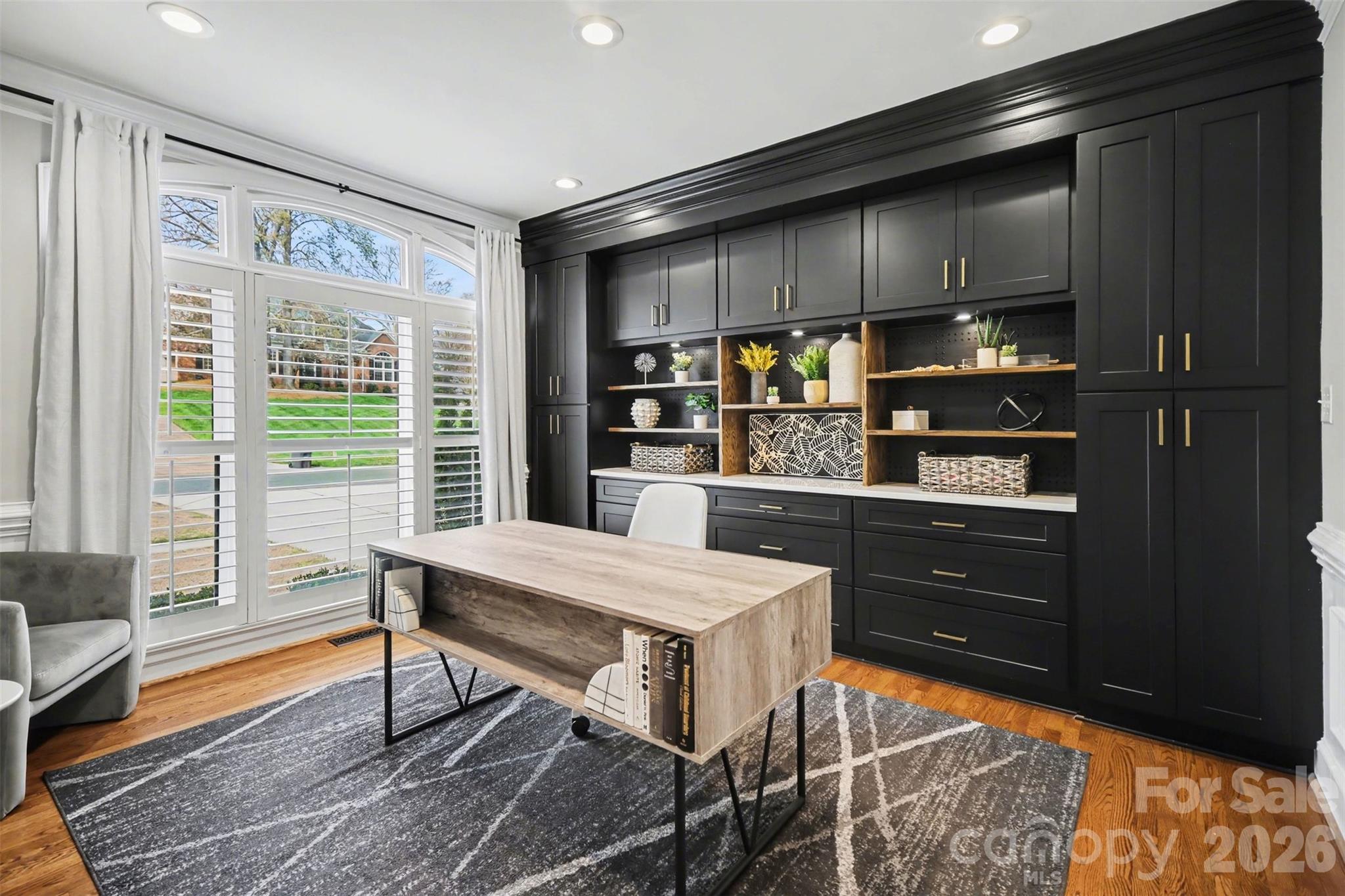 6008 Alexa Road Charlotte, NC 28277 - Photo 5 of 46 a kitchen with stainless steel appliances kitchen island granite countertop a refrigerator and a stove top oven