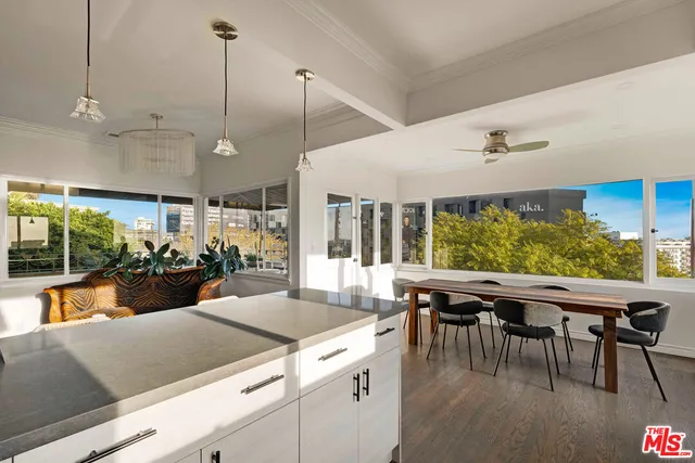 a view of a dining room with furniture window and outside view