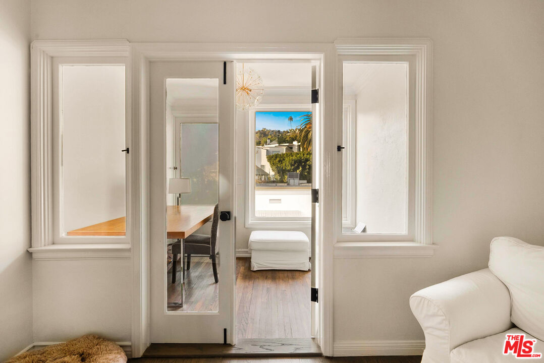 1326 Londonderry View Drive, Unit 7 Los Angeles, CA 90069 - Photo 17 of 21 a living room with furniture and a window