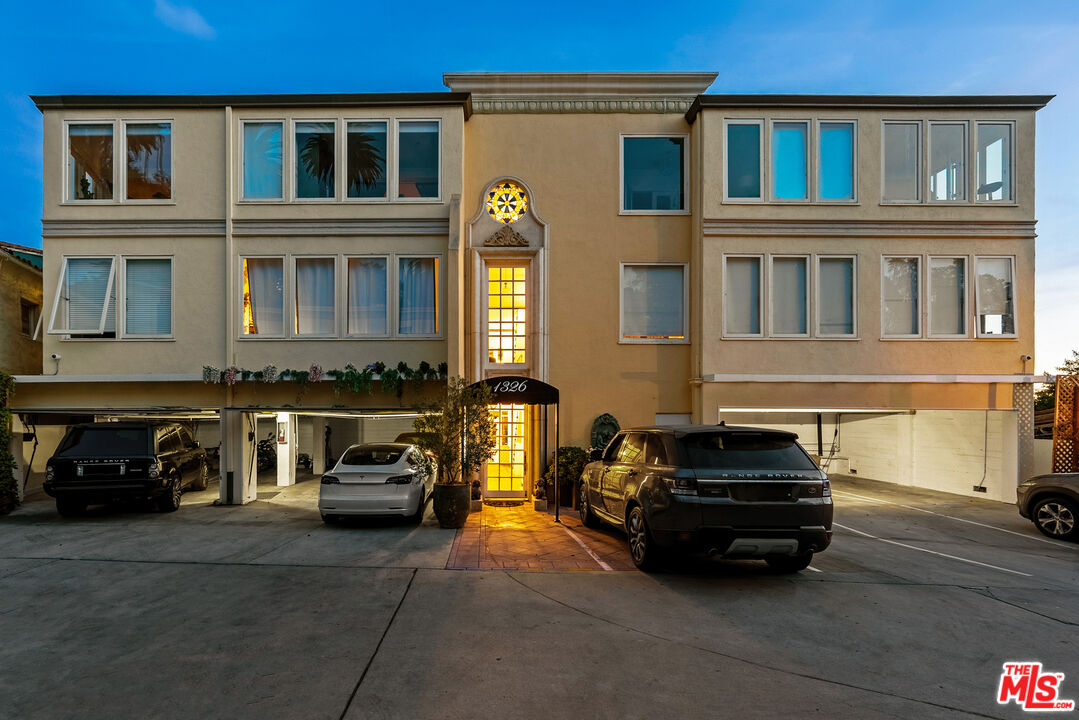 1326 Londonderry View Drive, Unit 7 Los Angeles, CA 90069 - Photo 2 of 21 a car parked in front of a building