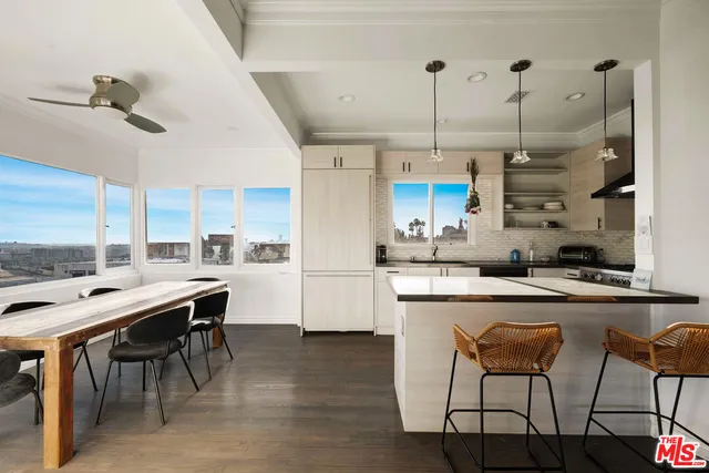 a kitchen with stainless steel appliances granite countertop counter space a sink refrigerator and cabinets