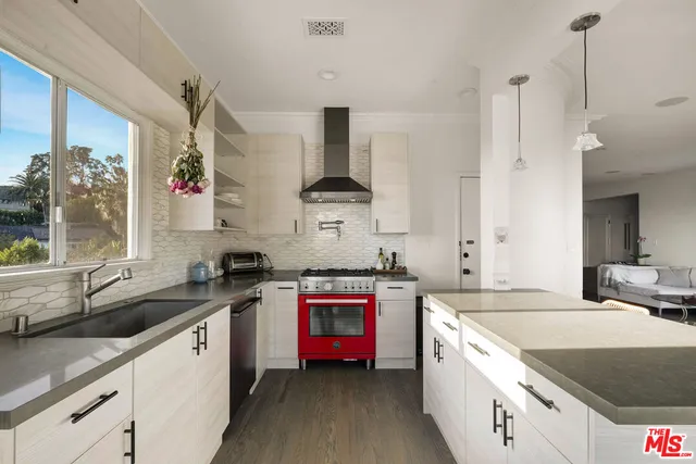 a kitchen that has a sink and a stove