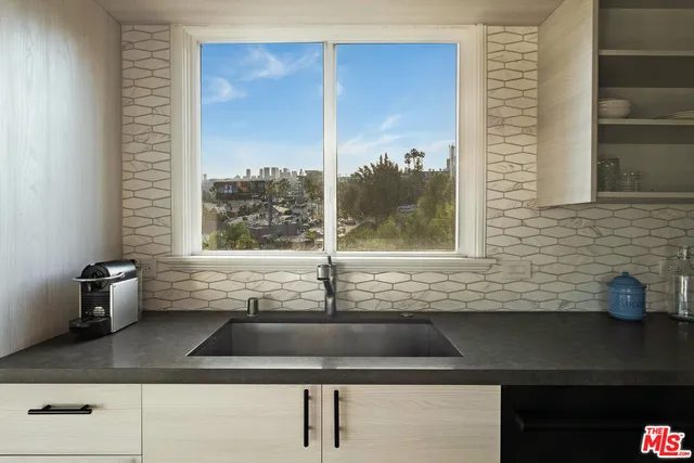 a kitchen with a sink and a window