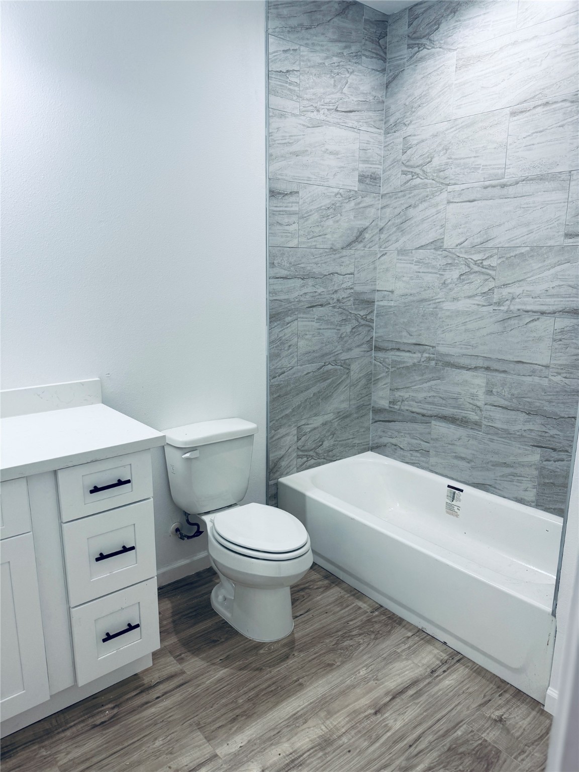 5214 Rue Street, Unit A B Houston, TX 77033 - Photo 6 of 13 a bathroom with a toilet a sink and bathtub
