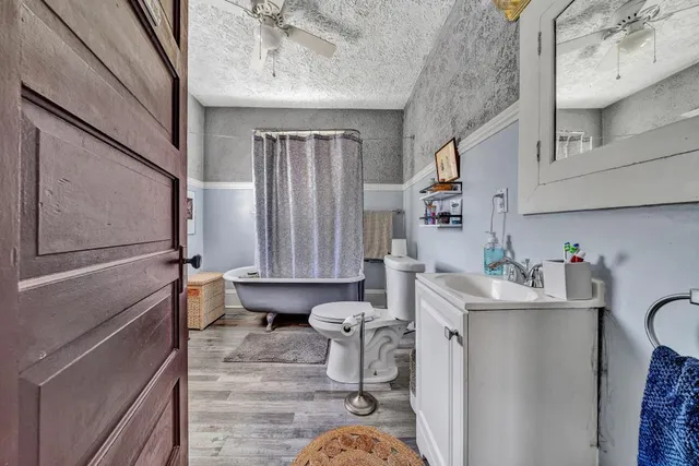 a room with a sink a washer and dryer