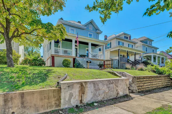 front view of a building with a garden