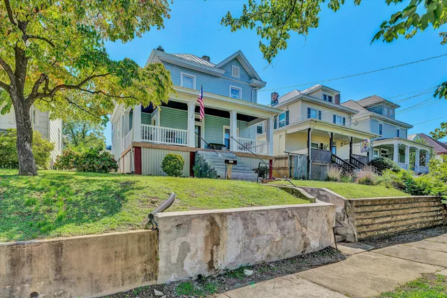 front view of a building with a garden