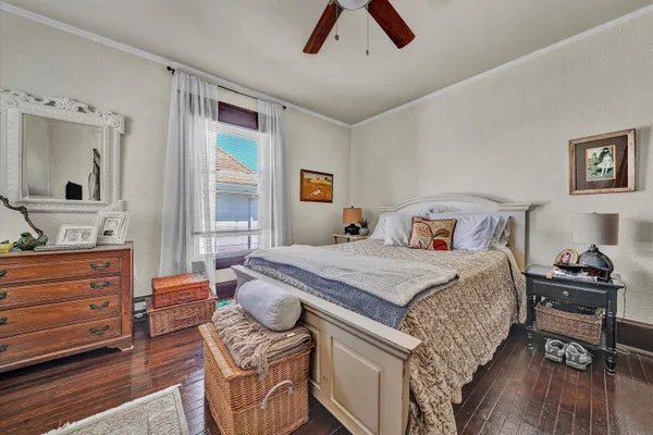 a bedroom with a bed and a dresser