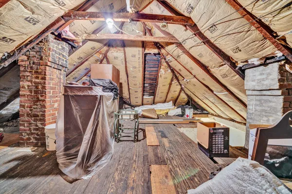 a view of balcony with wooden floor and outdoor seating