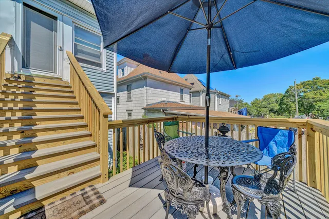 a view of a house with backyard and porch