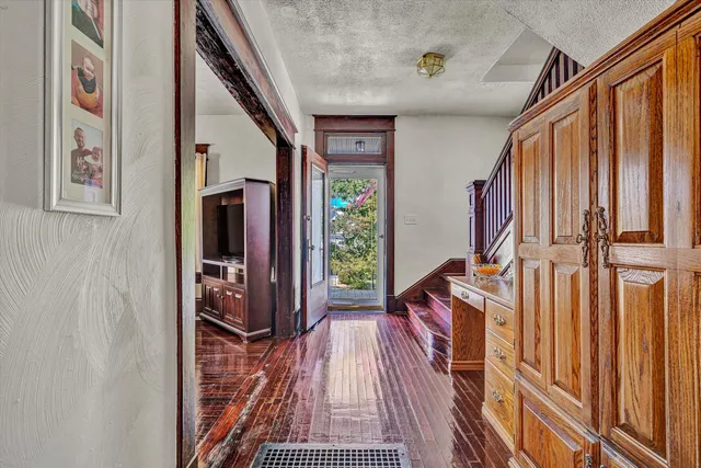 a view of stairs and the main door