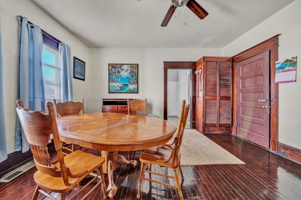 a dining room with furniture and window