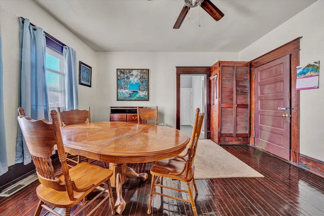 a dining room with furniture and window
