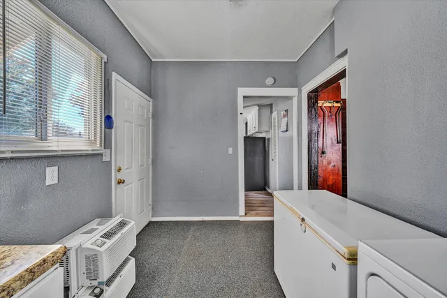 a view of a hallway with windows