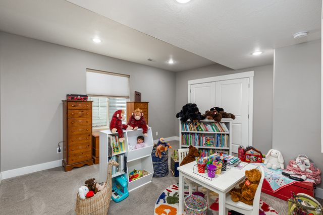 1132 Sunset Dunes Way Draper, UT 84020 - Photo 27 of 35 Carpeted room featuring recessed lighting, a window with blinds, and white trim