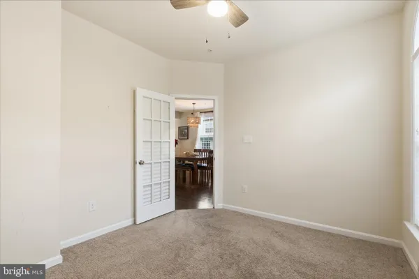 an empty room with a kitchen