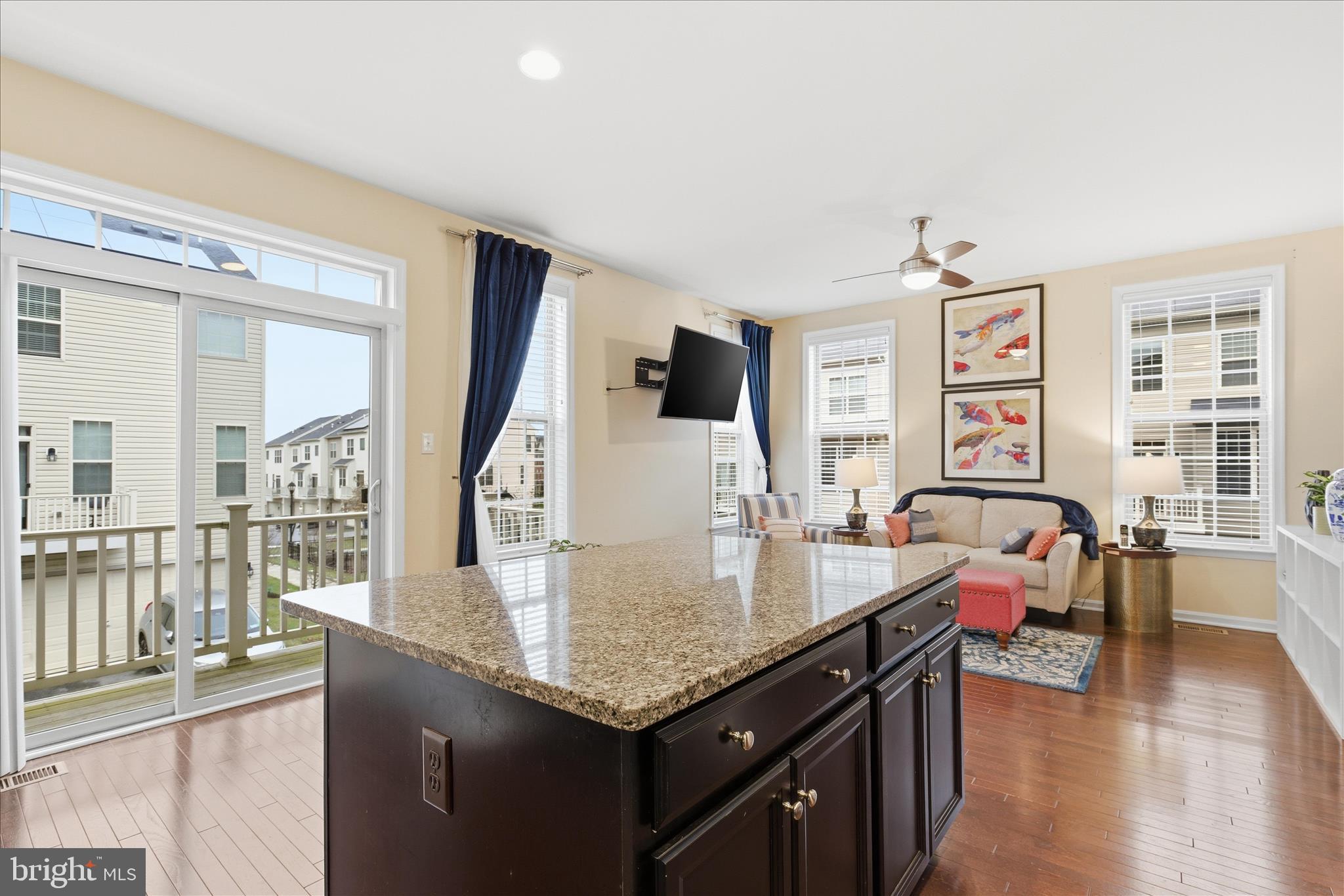 9511 Smithview Place Lanham, MD 20706 - Photo 20 of 33 a living room with furniture a large window and wooden floor