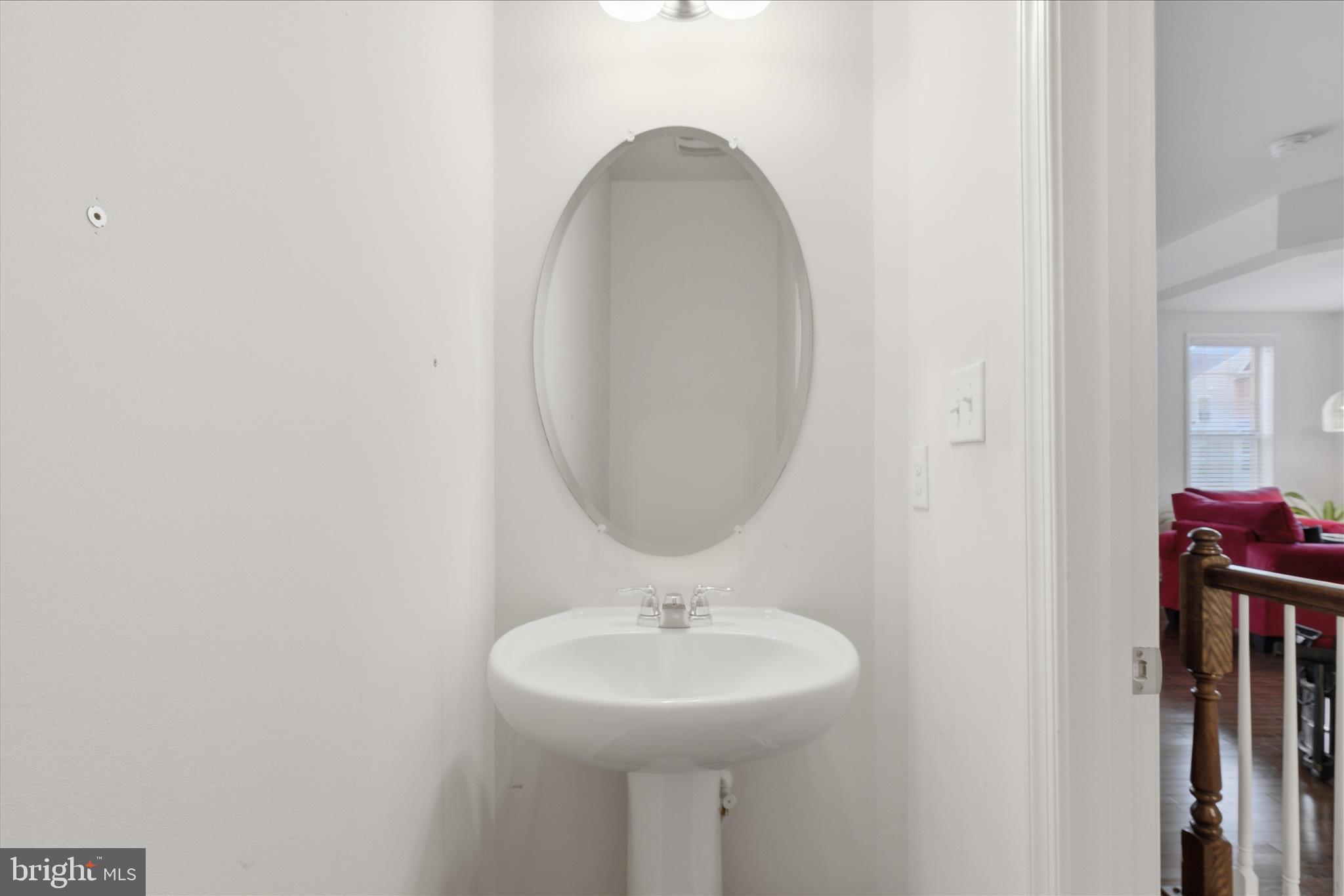 9511 Smithview Place Lanham, MD 20706 - Photo 21 of 33 a bathroom with a sink and a mirror