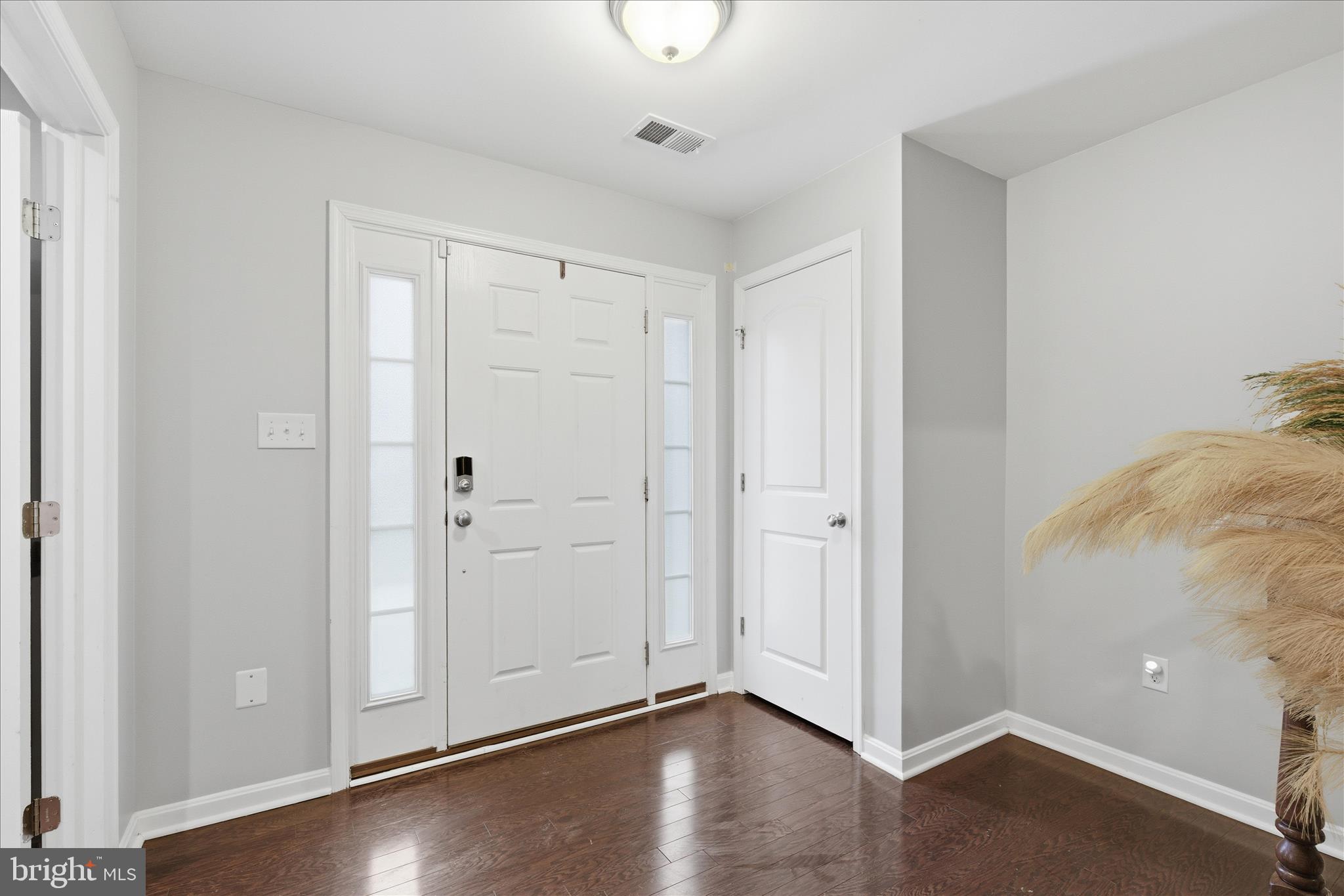 9511 Smithview Place Lanham, MD 20706 - Photo 3 of 33 a view of an empty room with wooden floor