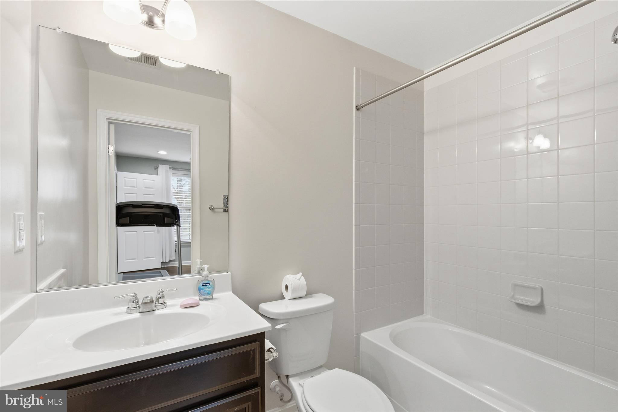 9511 Smithview Place Lanham, MD 20706 - Photo 7 of 33 a bathroom with a sink toilet vanity and shower