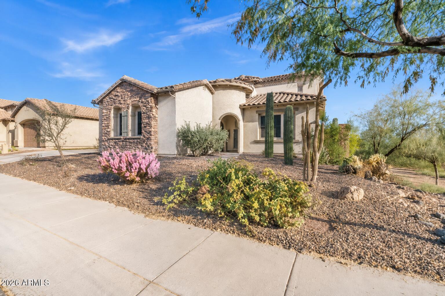 1615 West Red Fox Road Phoenix, AZ 85085 - Photo 3 of 64 a front view of a house with a yard