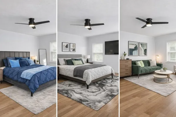 a spacious bedroom with a bed a couch and a flat screen tv