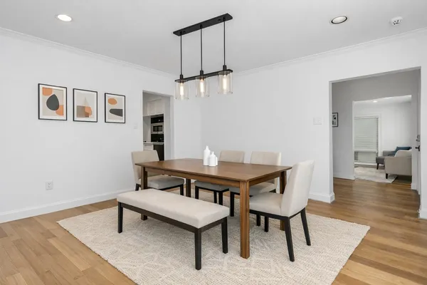 a view of a livingroom with furniture and wooden floor