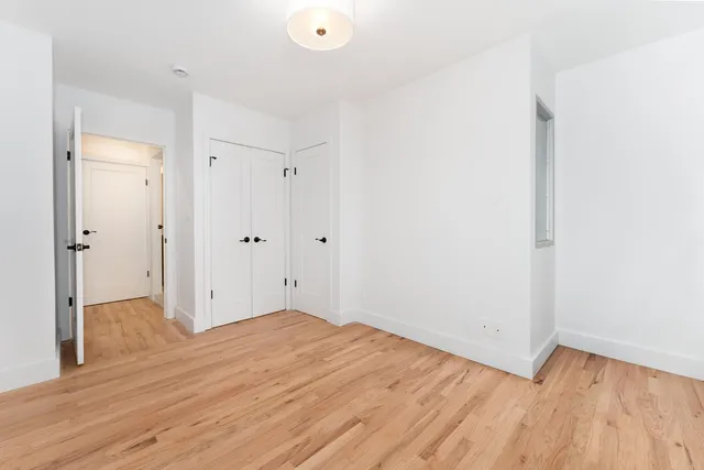 a bathroom with a shower and a glass door