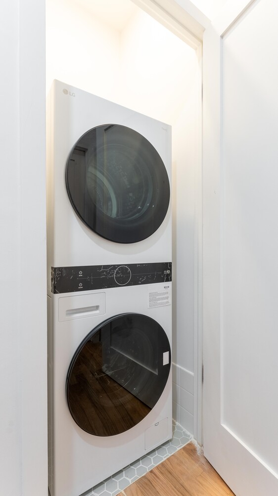 121 Division Street, Unit 2A Manhattan, NY 10002 - Photo 22 of 23 a close up view of a washer and dryer