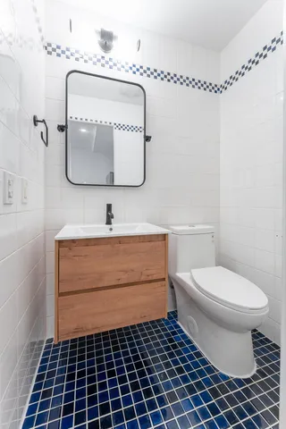 a kitchen with stainless steel appliances a stove a sink and a refrigerator