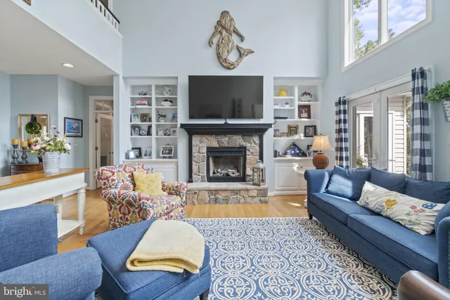 a living room with furniture fireplace and flat screen tv