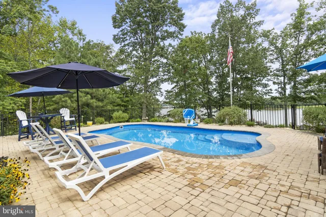 a view of a swimming pool with a patio