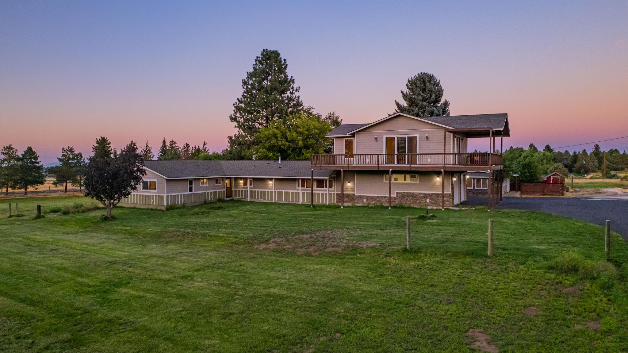 62466 Eagle Road Bend, OR 97701 - Photo 4 of 93 a front view of a house with a garden