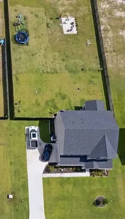 view of a pool table and chairs in an outdoor space