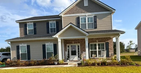 front view of a house and a yard
