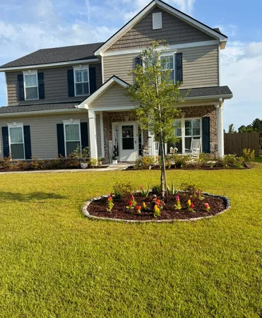 a front view of a house with a yard