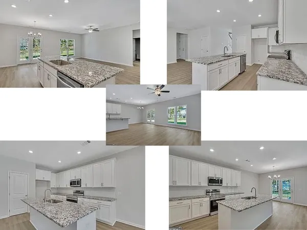 a view of kitchen with kitchen island sink and center island