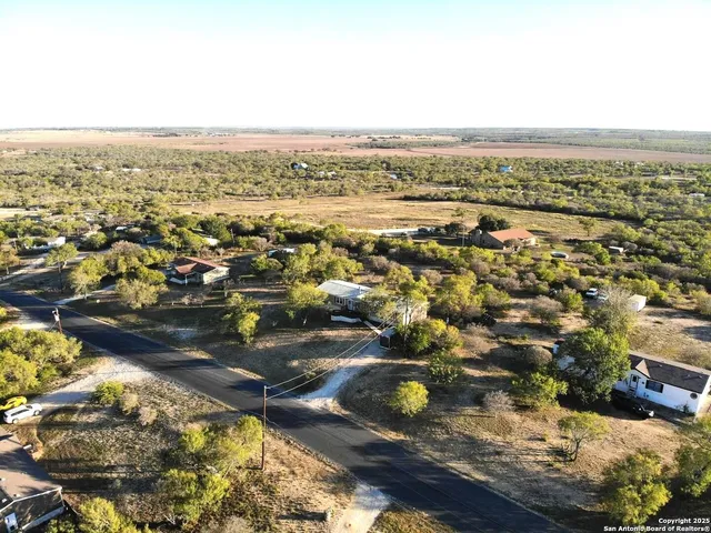 an aerial view of residential house with outdoor space