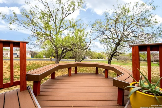 a view of a balcony with trees