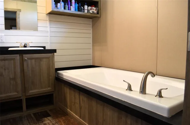 a bathroom with a sink and a mirror