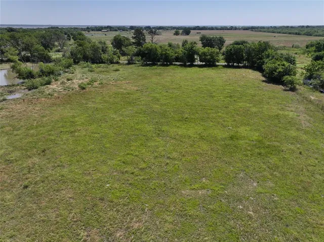 a view of a field with an outdoor space