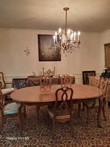 a kitchen with stainless steel appliances a stove a sink and cabinets