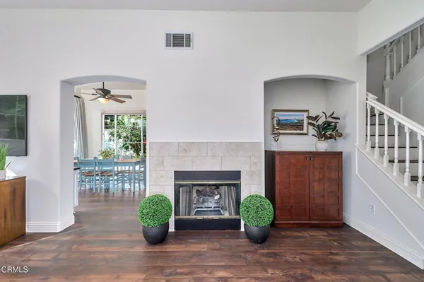 a living room with furniture and a fireplace