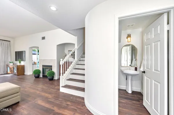 a bathroom with a double vanity sink and a mirror