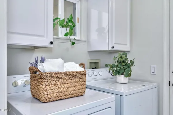 a spacious bathroom with a double vanity sink and a mirror