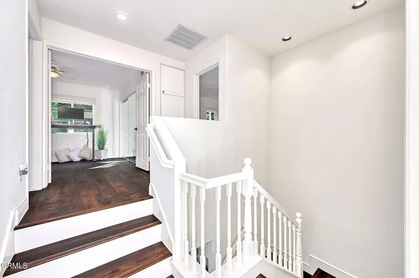 a bathroom with a double vanity sink a mirror and a shower