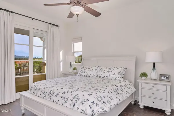a living room with furniture and a book shelf