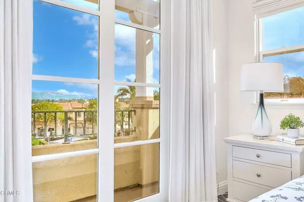 a front view of a house with plants